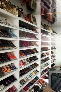 there are many pairs of shoes on the shelves