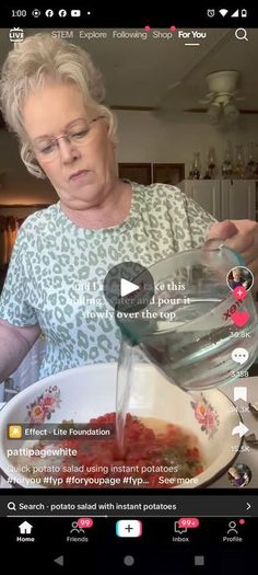 a woman pouring water into a bowl with food in it on the screen, and another person looking at her phone