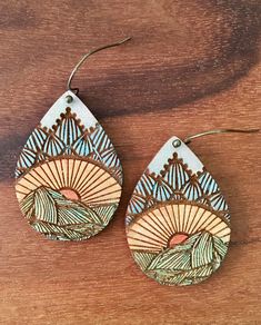 "Celebrating Sundance, Utah, these natural, lightweight, wooden earrings are made of 1/8\" birch and are designed and handmade in my workshop in Texas. Each earring is cut and scored or engraved using a Glowforge laser printer and are hand painted. The hooks are hypo-allergenic and nickel-free in an antique bronze or silver finish to compliment the natural wood. To keep your earrings in their very best condition, please do not submerge in water." Woodburned Earrings Diy, Wood Painted Earrings, Wooden Earrings Diy, Wood Burning Earrings, Wood Burned Earrings Diy, Wood Burn Earrings, Timber Earrings, Wood Burnt Earrings, Laser Cut Earrings Wood