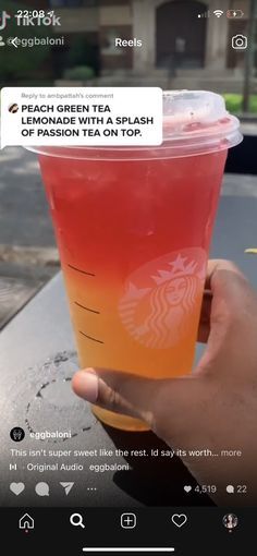 someone is holding up a cup of tea with orange and pink liquid in it that reads peach green tea lemonade with a splash