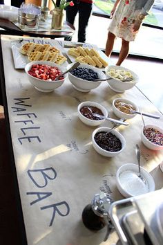 a table topped with lots of different types of waffles on top of it