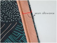 the side of a scarf with an arrow pointing to it