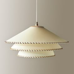 a white light hanging from a ceiling fixture