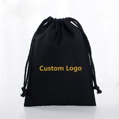 a black bag with the word custom logo printed on it