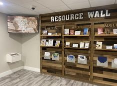 there is a sign on the wall that says, resources and children's books