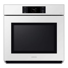 a white oven with the door open and clock on it's side, in front of a white background