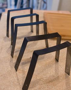 three metal objects sitting on top of a counter