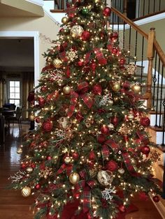 a christmas tree decorated with red and gold ornaments