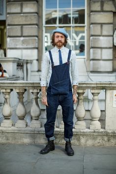 Shop this look on Lookastic: https://lookastic.com/men/looks/long-sleeve-shirt-overalls-boots-hat-tie/12913 — Light Blue Hat — Grey Vertical Striped Long Sleeve Shirt — Blue Denim Tie — Navy Overalls — Black Leather Boots Overalls And Boots, Wearing Overalls, Estilo Hipster, Striped Long Sleeve Shirt, Hipster Fashion