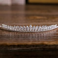 a tiara is sitting on a wooden table