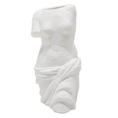 a white sculpture is shown against a white background with the image of a woman's head wrapped in a towel