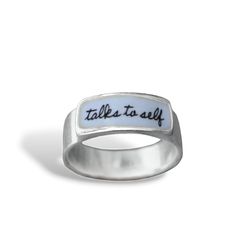 Is it time to admit that you talk to yourself? Come out in style. Each ring is cast in sterling silver, to which 3 layers of vitreous enamel are applied and fired at 1400 degrees making a durable, waterproof and vibrant ring. Band width goes from 1/8" up to 1/4" depending on the size.  Available in whole sizes 5-12. I ship First Class Mail in a gift box. To see my entire store go here:  https://www.etsy.com/shop/marmar To see my gemstone and modern store go here: https://www.etsy.com/shop/marmar Inspirational Silver Promise Ring, Silver Sterling Silver Enamel Promise Ring, Silver Enamel Promise Ring, Meaningful Sterling Silver Rings With Engraving Option, Silver Stackable Enamel Ring As Gift, Silver Stackable Enamel Ring Gift, Talk To Yourself, Glass Store, Modern Store