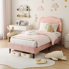 a child's bedroom with pink bedding and white rugs on the floor