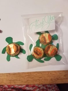 there are four chocolates in the package on the table and one has a sea turtle