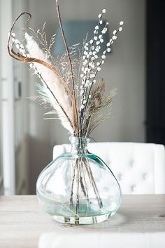 a vase filled with flowers on top of a table