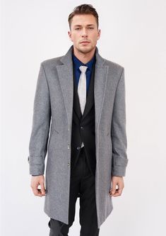 Boost your style in the timeless Light Grey Wool Classic Overcoat. Crafted from luxurious melton wool with attention to detail, this coat is custom-made for a sophisticated and classy vibe. Make an elegant statement with this sleek overcoat. Elegant Long Wool Coat, Formal Solid Color Long Wool Coat, Formal Long Wool Coat With Concealed Placket, Timeless Wool Coat For Business Casual In Winter, Formal Long Pea Coat With Hidden Button Closure, Elegant Tailored Long Wool Coat, Formal Winter Wool Coat With Hidden Buttons, Formal Wool Coat With Hidden Button Closure For Winter, Formal Winter Wool Coat With Hidden Button Closure