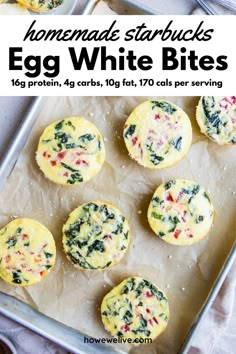 egg white bites with spinach and cheese in the middle on a baking sheet, ready to be eaten