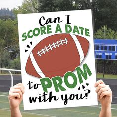 a person holding up a sign that says, can i score a date to prom with you?