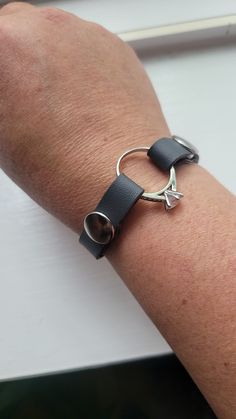 "This Ring Holder Bracelet is a vegan skinny (3/8 inch wide aka 10mm wide) material to hold your loved one's ring. It is soft, petite, the snaps slightly overlay the width, and the most affordable bracelet I sell. For a bracelet that can take a little more wear and tear, please choose a medium-weight or heavier bracelet (see sections on left side of shop): https://bit.ly/3LHOyql When you order, write the ring size (roughly) or diameter (side to side) in the \"note to seller\" and also let me kno Bracelet Made From Wedding Rings, Formal Jewelry With Adjustable Black Band, Widow's Ring, Memorial Bracelet, Fitness Bracelet, Wedding Jewelry Bracelets, Paramedic, One Ring, Ring Band