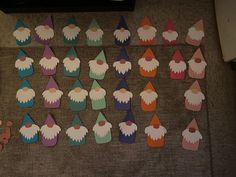 there are many small cupcakes that have been made to look like gnomes