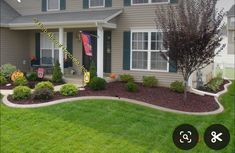 a house with landscaping in front of it and the number 3 on the front lawn