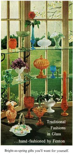 an advertisement for glass vases in front of a window with flowers and candles on it