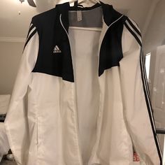 Black And White Adidas Wind Breaker. Never Worn. White Adidas Windbreaker For Spring, Adidas White Outerwear For Spring, White Adidas Outerwear For Spring, White Adidas Hooded Windbreaker, White Hooded Adidas Windbreaker, Adidas White Outerwear For Fall, Adidas Casual White Track Jacket, White Adidas Outerwear For Fall, Casual White Adidas Track Jacket