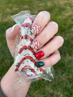 BRING THE HOLIDAY IN - The Christmas themed patterns & designs will easily match any holiday parties & seasonal decoration styles, bring the holiday in! Try Them Now christmas nail art #sponsered #nailart #christmasnails #fashion #winternails Christmas Tree Cake Nail Art, Christmas Anc Nails, Grinch Dip Nails, Ornament Nails Christmas, Holiday Mani Pedi Combo, Square Christmas Nail Designs, Little Debbie Nails, Little Debbie Christmas Tree Cake Nails, Christmas Cake Nails