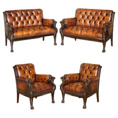 a set of three brown leather couches with ornate carvings on the armrests