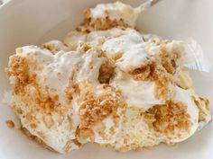 a close up of a bowl of food with ice cream and cinnamon crumbs