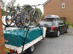 two bikes are strapped to the back of a truck