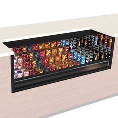 a display case filled with lots of different types of canned drinks and beverages in cans