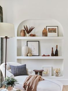 a living room filled with furniture and decor