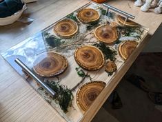 a wooden table topped with lots of wood slices