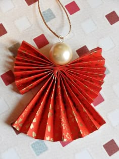 the origami christmas angel decoration in red and gold is on sale for $ 2