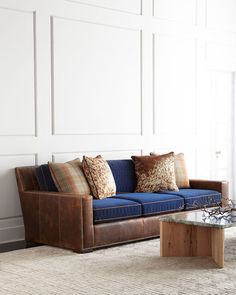 a living room with a blue couch and coffee table