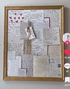 a collage of letters and papers is hanging on the wall with a gold frame