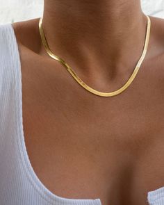 Herringbone chain necklace for a gorgeous slinky layered look Necklace is 14.5" long with 3" extender chain (17.5" total length) Chain is 0.15" (4mm) wide Made from Brass Plated 18K Gold Lobster claw clasp Necklace is 100% nickel-free and cadmium-free Basic Chain Necklace, Tan Skin Gold Jewelry, Gold Necklace Herringbone, Trending Chains For Women, Gold Thick Necklace, Gold Classy Necklace, Antique Gold Chain Women, Gold Flat Necklace, Herringbone Gold Necklace