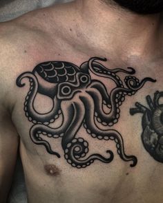 an octopus tattoo on the chest is shown in black and grey ink with a human heart