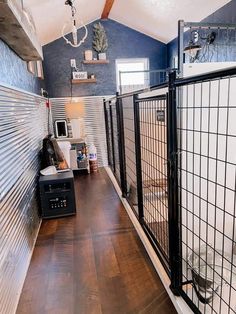 this is a long hallway in a house with wood flooring and metal railings