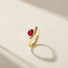 Resting elegantly at the heart of this nouveau design is a vibrant oval shaped ruby cradled within the soft curvature of the shank. The sculptural form presents a clean yet striking statement that has been designed with ease of wearability in mind. This is the quintessential choice for daily wear. Metal: 18kt Gold Ruby Weight: 0.95 ct. Measurements: 9.0 mm length *Please note that the listed ct. weights are approximate and may be subject to slight variations. Luxury Oval Ruby Ring With Polished Finish, Luxury Oval Ruby Birthstone Ring, Timeless Polished Yellow Gold Ruby Ring, Timeless Yellow Gold Ruby Ring With Polished Finish, Modern Yellow Gold Ruby Ring For Formal Events, Timeless Ruby Ring In Yellow Gold With Polished Finish, Modern Yellow Gold Ruby Ring For Formal Occasions, Modern Ruby Wedding Ring, Elegant Ruby Ring With Tension Setting