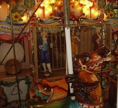 an old fashioned merry go round with lights