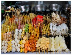 many different types of food on sticks