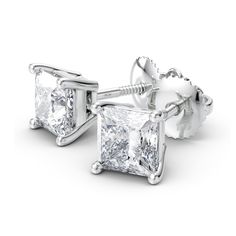 A token of true love, surprise her with diamonds. Fashionable, contemporary and regal, princess-cut diamond solitaire studs display spectacular brilliance. These 2 ct. t.w. certified princess-cut diamond solitaire stud earrings in 18K white gold glisten with a color ranking of I and a clarity ranking of Vs2. Add sparkle to her ears with radiant screw back diamond stud earrings. These certified diamond earrings come with a certificate that includes a photo and a description of the diamond, which Love Surprise, Solitaire Earrings, Solitaire Studs, Square Stud, Diamond Stud Earrings, Diamond Stud, Princess Cut Diamonds, 2 Carat, Diamond Earrings Studs