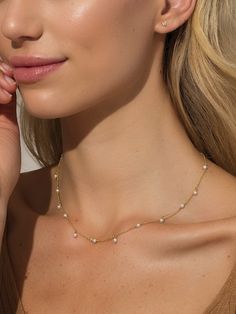 Our Flirty Pearl Necklace is the most fun you can have with pearls. Combining a dainty chain and pearl details, this gold and pearl necklace is ready for everyday wear. Pair it with pearl earrings for a full pearl jewelry look, or layer it with other gold necklaces for a new take on a classic style. Want more pearl jewelry? Shop our Pearl Capsule. | Flirty Pearl Necklace GOLD Gold And Pearl Necklace, Future Jewelry, Pearl Jewelry Shop, Uncommon James, Dainty Chain Necklace, Pearl Details, Gold Pearl Necklace, Dainty Chain, Gold Necklaces