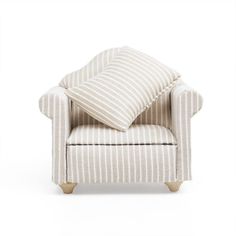 a striped chair with two pillows on it