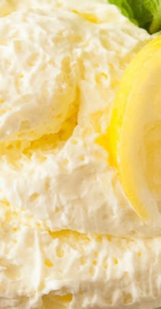 there is a lemon on top of the whipped cream