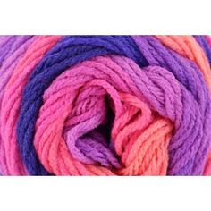 multicolored skeins of yarn on white background