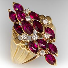 This vintage cluster ring features twelve (12) two-prong set, marquise cut rubies that are accented with seven (7) round brilliant cut diamonds. The shoulders feature a graduated, tiered design. The ring measures 36.4mm at the top, rises 13.6mm above the finger, tapering to 4.3mm wide and 1.9mm thick at the base of the shank. It is currently a size 8.25 with a spring ring insert. Formal Marquise Multi-stone Ruby Ring, Formal Multi-stone Marquise Ruby Ring, Formal Red Marquise Cut Cluster Ring, Vintage Cluster Ring, Designer Diamond Jewellery, Precious Jewels, Ruby Jewelry, Ruby Diamond, Diamond Cluster Ring