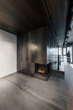 an empty room with a fire place in it